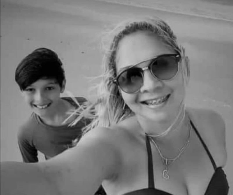 Helione de Andrade e o filho, Flávio Henrique, de 13 anos - (Reprodução)